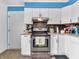 Well-equipped kitchen with stainless steel appliances, stylish tile, and ample countertop space at 12386 S Hillview Dr, Columbus, IN 47201