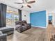Well-lit living room showcasing wood flooring, comfortable seating, and neutral color palette at 12386 S Hillview Dr, Columbus, IN 47201
