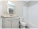 Well-lit bathroom featuring a vanity with storage, modern fixtures, and a tub-shower combo with subway tile at 1257 Newton St, Avon, IN 46123