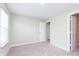 Comfortable bedroom with neutral carpet, window for natural light, and door leading to closet at 1257 Newton St, Avon, IN 46123