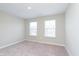 Cozy bedroom featuring plush carpeting, natural light, and modern design elements at 1257 Newton St, Avon, IN 46123