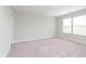 Bright bedroom featuring neutral carpet, walls, and abundant natural light from large windows at 1257 Newton St, Avon, IN 46123