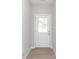 Bright entryway featuring a white door with glass window and wood-style flooring at 1257 Newton St, Avon, IN 46123