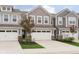 Beautiful townhouse with a spacious two-car garage and a well-kept front yard at 1257 Newton St, Avon, IN 46123
