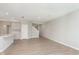 Bright, open living area with light wood floors, white walls, and staircase access at 1257 Newton St, Avon, IN 46123