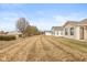 Backyard view of the home's exterior, grass and the neighborhood landscape at 1280 Vicksburg S Dr, Greenwood, IN 46143