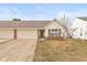 Charming single-story home featuring a two-car garage and a well-maintained front yard at 1280 Vicksburg S Dr, Greenwood, IN 46143