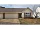 Charming home exterior featuring an attached two-car garage and inviting entrance at 1280 Vicksburg S Dr, Greenwood, IN 46143