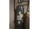 A Performance Plus Rheem water heater with a caution sticker sitting in the basement at 1282 Highpointe Blvd, Shelbyville, IN 46176