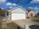 Charming single-story home with two car garage and concrete driveway at 1282 Highpointe Blvd, Shelbyville, IN 46176