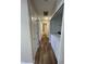 Hallway featuring wood-look vinyl flooring, access to bathroom, laundry, and bedrooms at 1282 Highpointe Blvd, Shelbyville, IN 46176