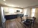 Bright modern kitchen with stainless steel appliances, two-tone cabinets, and lots of natural light at 1282 Highpointe Blvd, Shelbyville, IN 46176