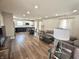 Open-concept living room with new flooring and a combined dining area and kitchen at 1282 Highpointe Blvd, Shelbyville, IN 46176