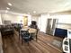 An open-concept living room with a connected dining area and kitchen features stainless steel appliances at 1282 Highpointe Blvd, Shelbyville, IN 46176