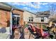 Charming back deck area featuring outdoor seating and sliding glass door access to the home at 1307 Estuary Dr, Indianapolis, IN 46217