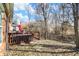 Backyard deck area offering a tranquil outdoor space with a fenced perimeter and natural surroundings at 1307 Estuary Dr, Indianapolis, IN 46217