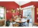 Charming dining room with a round table, elegant chandelier, and natural light from the sliding glass doors at 1307 Estuary Dr, Indianapolis, IN 46217