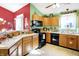 Bright kitchen boasts stainless steel appliances, a large window, and ample counter space at 1307 Estuary Dr, Indianapolis, IN 46217