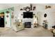Comfortable living room with a fireplace, TV, and open layout, seamlessly connecting to other living spaces at 1307 Estuary Dr, Indianapolis, IN 46217