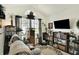 Cozy living room featuring a picture window, shelving, and comfortable seating at 1307 Estuary Dr, Indianapolis, IN 46217