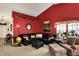 A beautifully decorated living room with a comfortable black sofa and lots of natural light from the window at 1307 Estuary Dr, Indianapolis, IN 46217