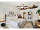 Bright main bedroom with a ceiling fan, neutral decor, and ample closet space at 1307 Estuary Dr, Indianapolis, IN 46217