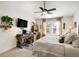 Comfortable main bedroom with a ceiling fan, a desk area, and a cozy window seat at 1307 Estuary Dr, Indianapolis, IN 46217