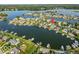 Aerial view of waterfront homes showcasing a pool and boat docks at 13499 Marjac Way, Fishers, IN 46055