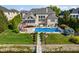 Aerial view of backyard with pool, dock, and manicured landscaping at 13499 Marjac Way, Fishers, IN 46055