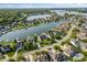 Expansive aerial perspective of luxury homes nestled on a lake, offering serene living and water amenities at 13499 Marjac Way, Fishers, IN 46055