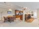 Basement area featuring wood table with chairs next to the bar area with barstools at 13499 Marjac Way, Fishers, IN 46055
