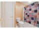 Bathroom featuring a toilet with patterned shower curtain at 13499 Marjac Way, Fishers, IN 46055