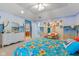 Bedroom featuring beach themed decor and furniture, with a plush floral comforter at 13499 Marjac Way, Fishers, IN 46055