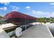 Boat on a lift under a cover with a covered boat house on a sunny day with beautiful blue sky at 13499 Marjac Way, Fishers, IN 46055