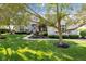 Charming brick home framed by mature trees and manicured landscaping offers classic curb appeal at 13499 Marjac Way, Fishers, IN 46055