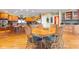 Open concept kitchen with a round wooden table and chairs. Seamlessly connects to living space and kitchen island at 13499 Marjac Way, Fishers, IN 46055