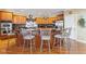 Kitchen with island seating, black granite countertops, and stainless steel appliances, perfect for casual dining at 13499 Marjac Way, Fishers, IN 46055