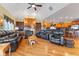 Spacious living room featuring hardwood floors, a fireplace, and comfortable seating for entertaining guests at 13499 Marjac Way, Fishers, IN 46055