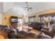 Bright living room features large windows, hardwood floors and comfortable seating perfect for relaxing at 13499 Marjac Way, Fishers, IN 46055