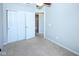 Carpeted bedroom has double sliding door closet and an open doorway to ensuite at 14041 Wimbleton Way, Fishers, IN 46037