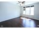 Bedroom with dark hardwood floors and a large window for natural light at 14041 Wimbleton Way, Fishers, IN 46037