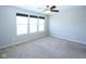 Bright bedroom with large windows and ceiling fan, carpeted floor, and fresh neutral paint at 14041 Wimbleton Way, Fishers, IN 46037