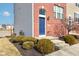 Close-up view of a brick townhome entrance with a blue door at 14041 Wimbleton Way, Fishers, IN 46037