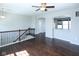 Open-concept living area with hardwood floors and ample natural light at 14041 Wimbleton Way, Fishers, IN 46037