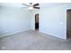Bright, carpeted main bedroom features a ceiling fan and ensuite bathroom at 14041 Wimbleton Way, Fishers, IN 46037