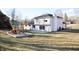 Spacious backyard with a playset and a large patio, perfect for outdoor entertaining at 1634 Muessing Rd, Indianapolis, IN 46239