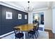 Spacious dining room showcasing stylish decor, modern lighting, and an open layout at 1634 Muessing Rd, Indianapolis, IN 46239