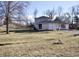 Two-story home with a combination of traditional siding and stonework details at 1634 Muessing Rd, Indianapolis, IN 46239