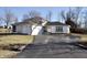 Charming single-Gathering home with a two-car garage and well-maintained front yard at 1634 Muessing Rd, Indianapolis, IN 46239
