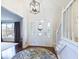 Inviting foyer with a stylish light fixture, staircase, and a decorative rug at 1634 Muessing Rd, Indianapolis, IN 46239